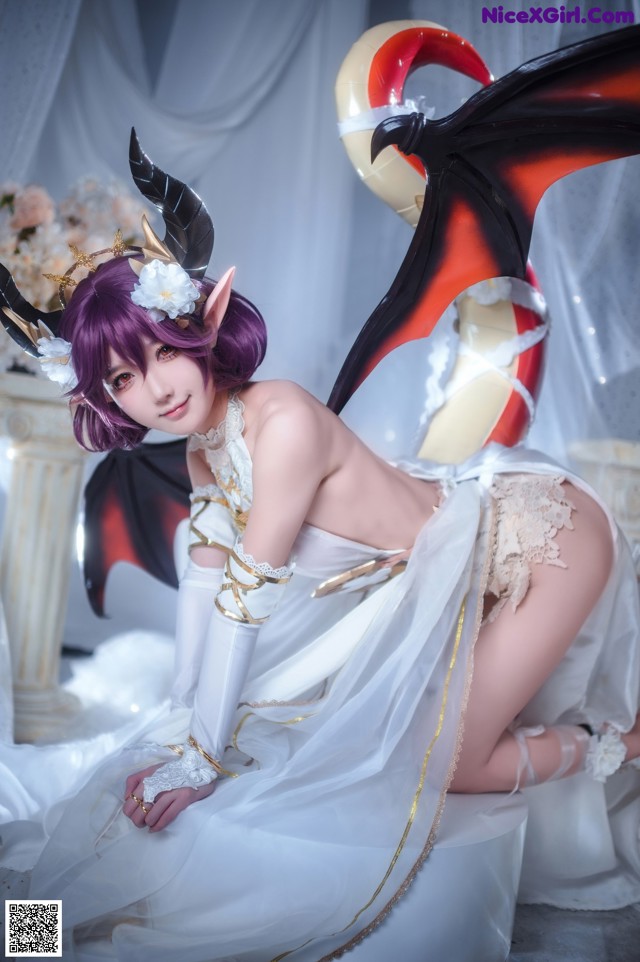 A woman in a white dress with purple hair and horns.